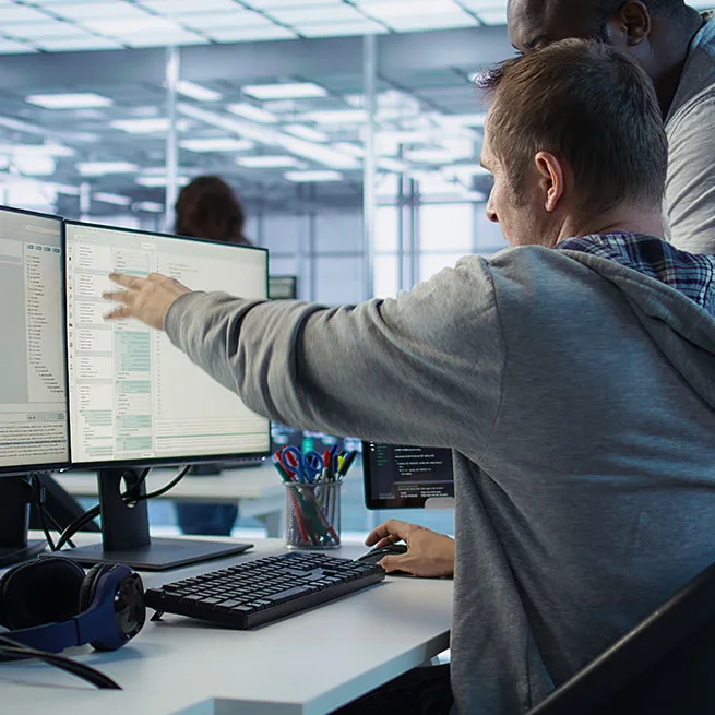 people looking at stats on computer